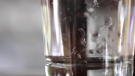 filling a glass with water