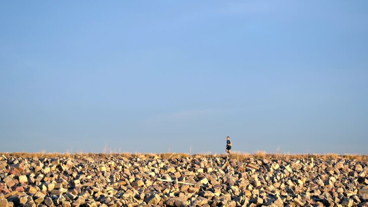 Man running in a trail along the Boulder Reservoir, Colorado