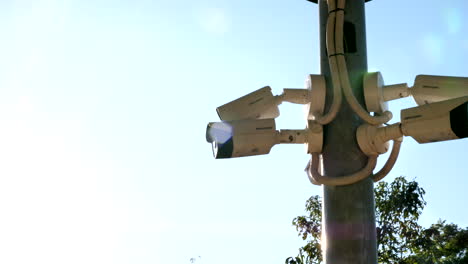 wide-shot-of-security-cameras-on-a-post-from-left-side