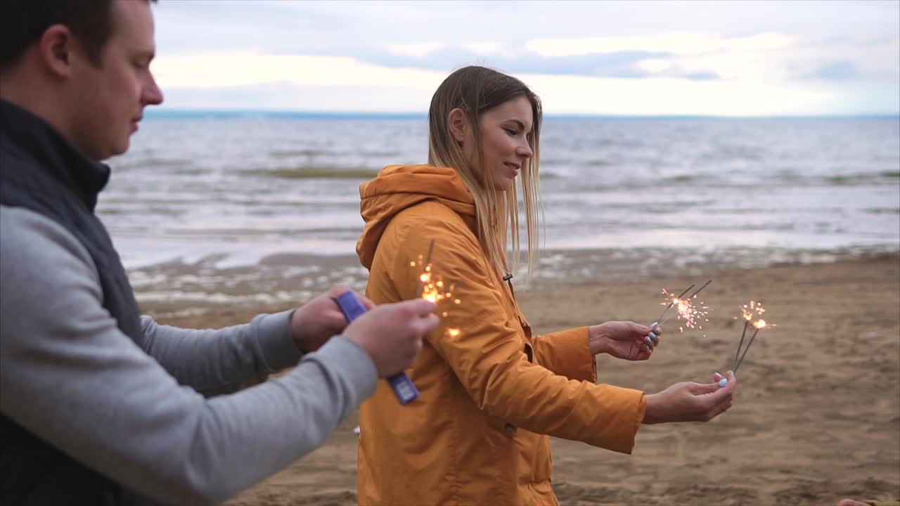 Family enjoying sparklers on the beach