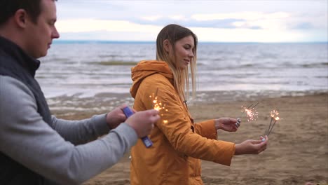 Family enjoying sparklers on the beach