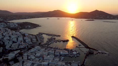 a high-altitude wide shot of the charming naoussa village on the island of paros, greece