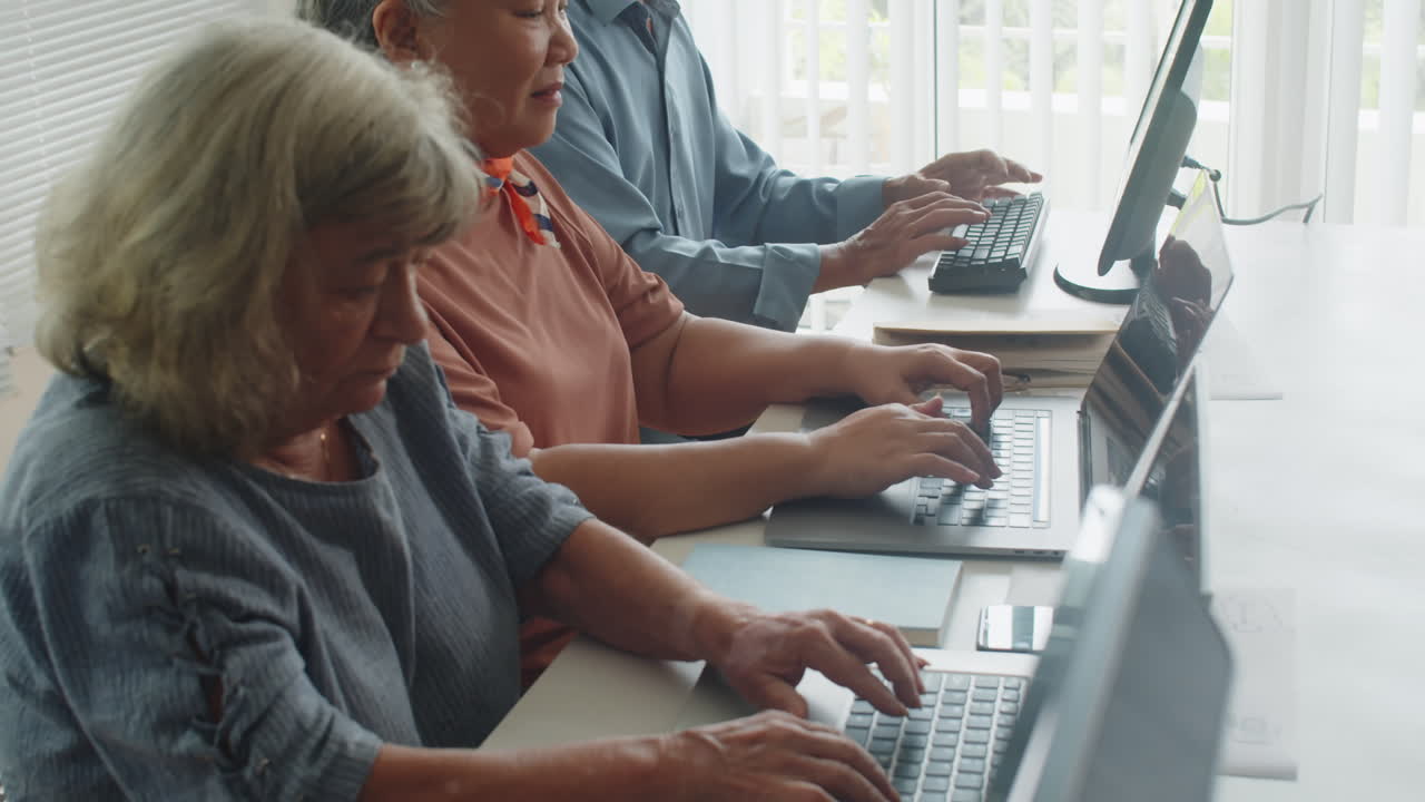Mature People Attending Computer Lesson