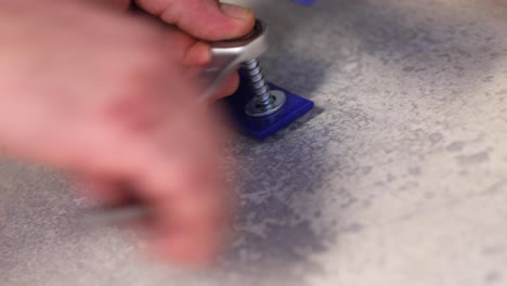 the worker who repairs and installs the toilet bowl and flush uses tools such as pliers and spanners