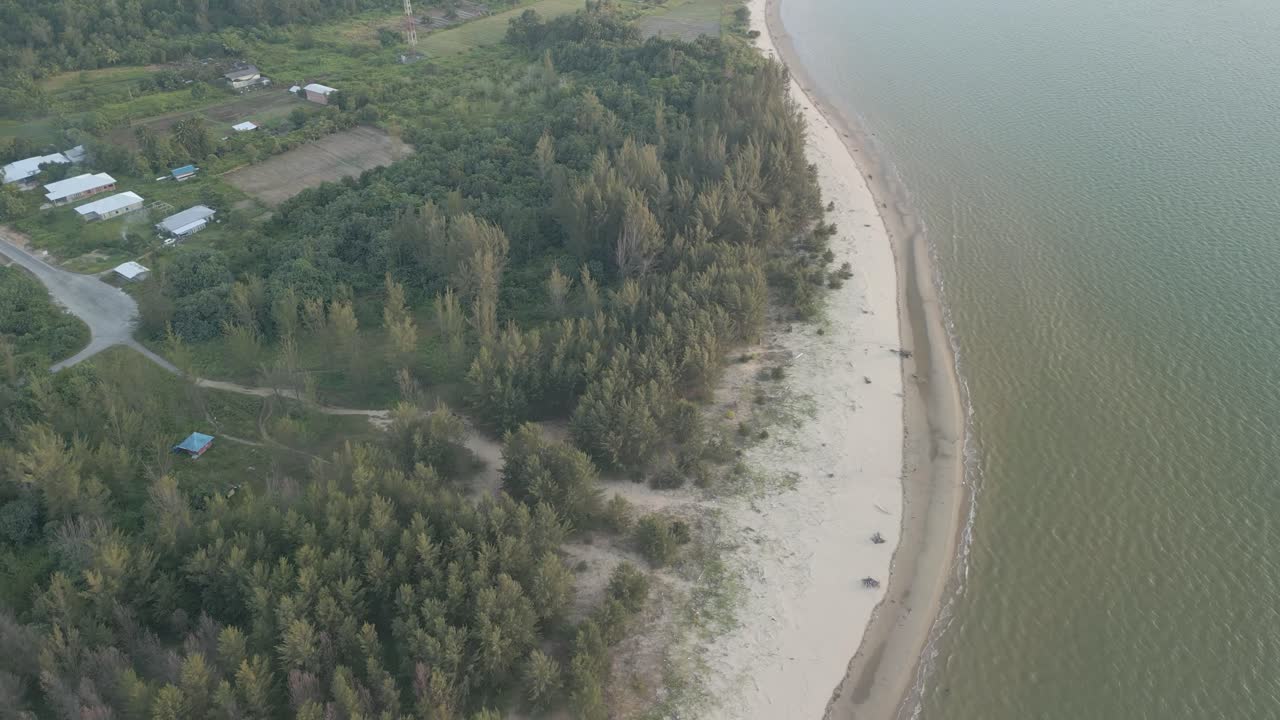 Aerial Drone View During Summer Gerigat Fishing Village,Kabong With, Facing Open Blue Sea, White Sandy Beach,Green Coconut, Palm Trees,And River,Sarawak,Borneo