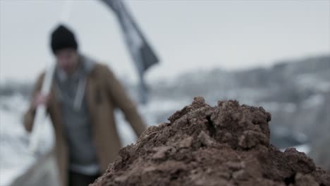 person standing on a mountain top in winter