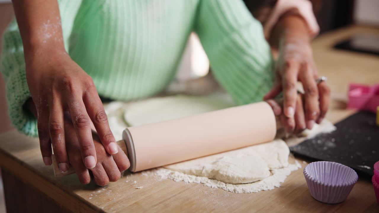 Mother and daughter baking cookies