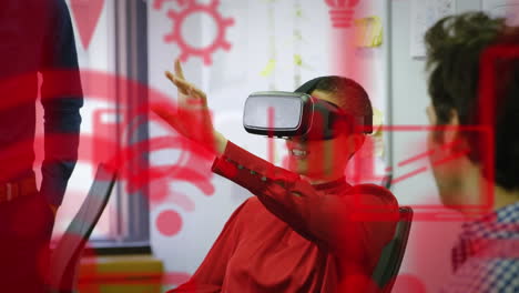 multiple red digital icons floating against caucasian businesswoman wearing vr headset at office