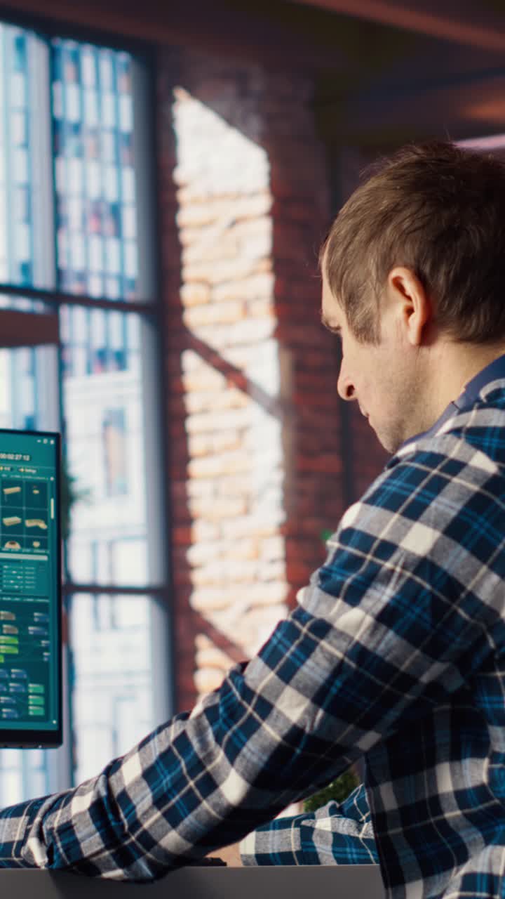 Vertical video Man doing remote work on computer screen, moving assets in 3D software