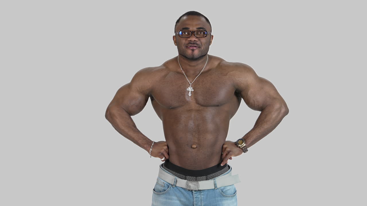 Portrait of muscular athlete with dark skin. African american sportsman without shirt posing in studio. Healthy lifestyle.