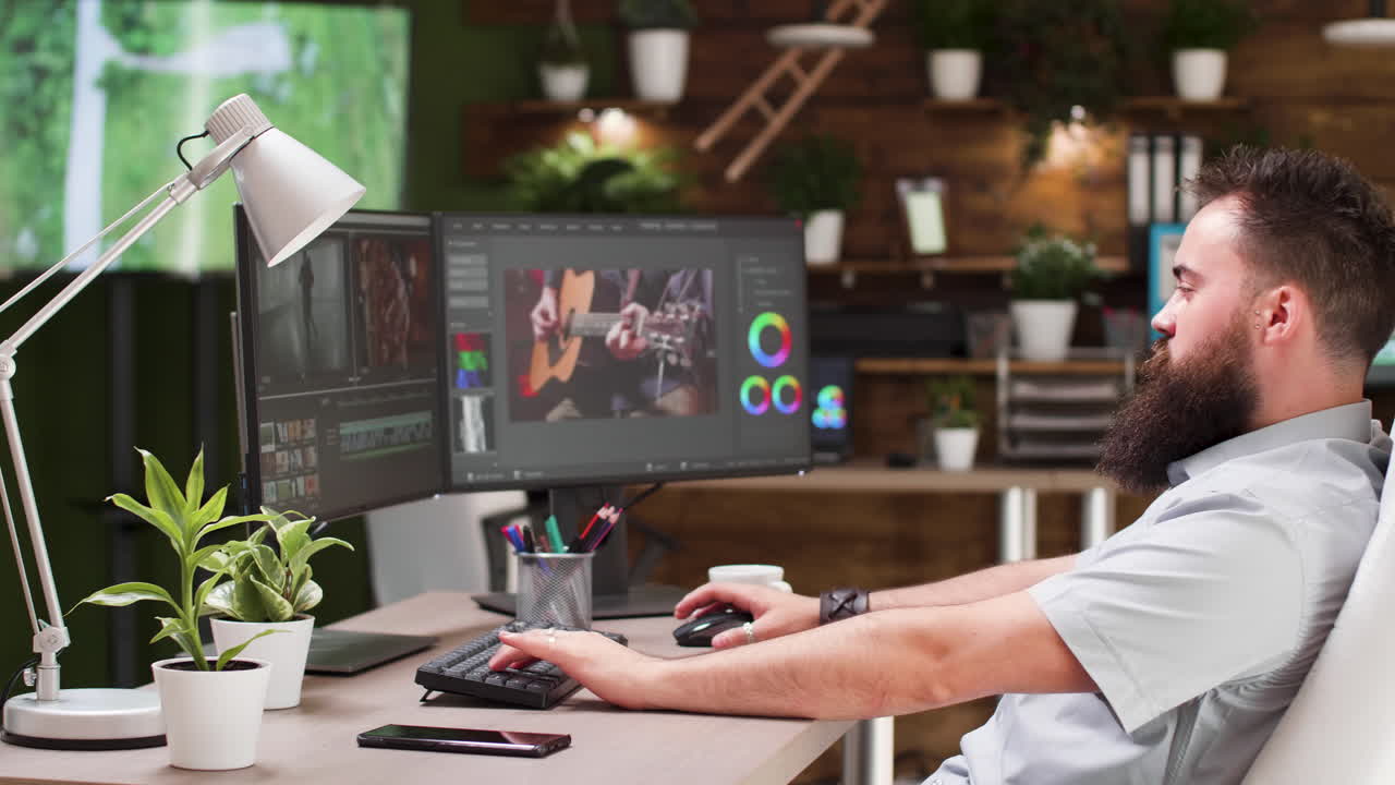 Man working on video editing at his desk