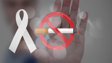 Animation-of-lit-cigarette-with-no-smoking-sign-and-white-ribbon-over-hand