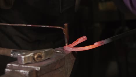 blacksmith working on a horseshoe