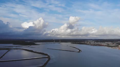 aerial shot of big salt flats area for sea salt production at arade river in portugal