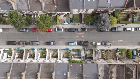 top-down view of a residential street lined with terraced houses and vehicles, peckham, london, uk, october 2024