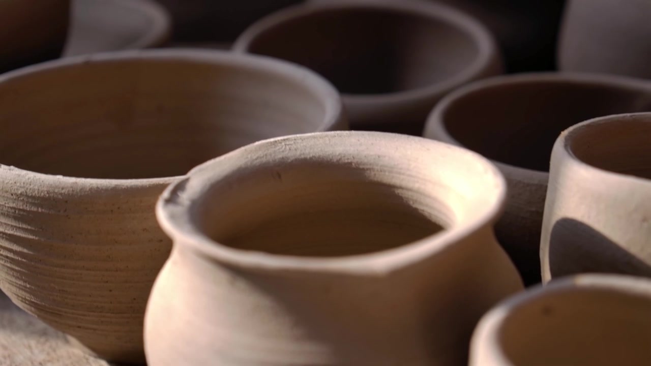 Pottery Shop With Rustic Clay Pots In A Variety Of Sizes. Tracking Shot