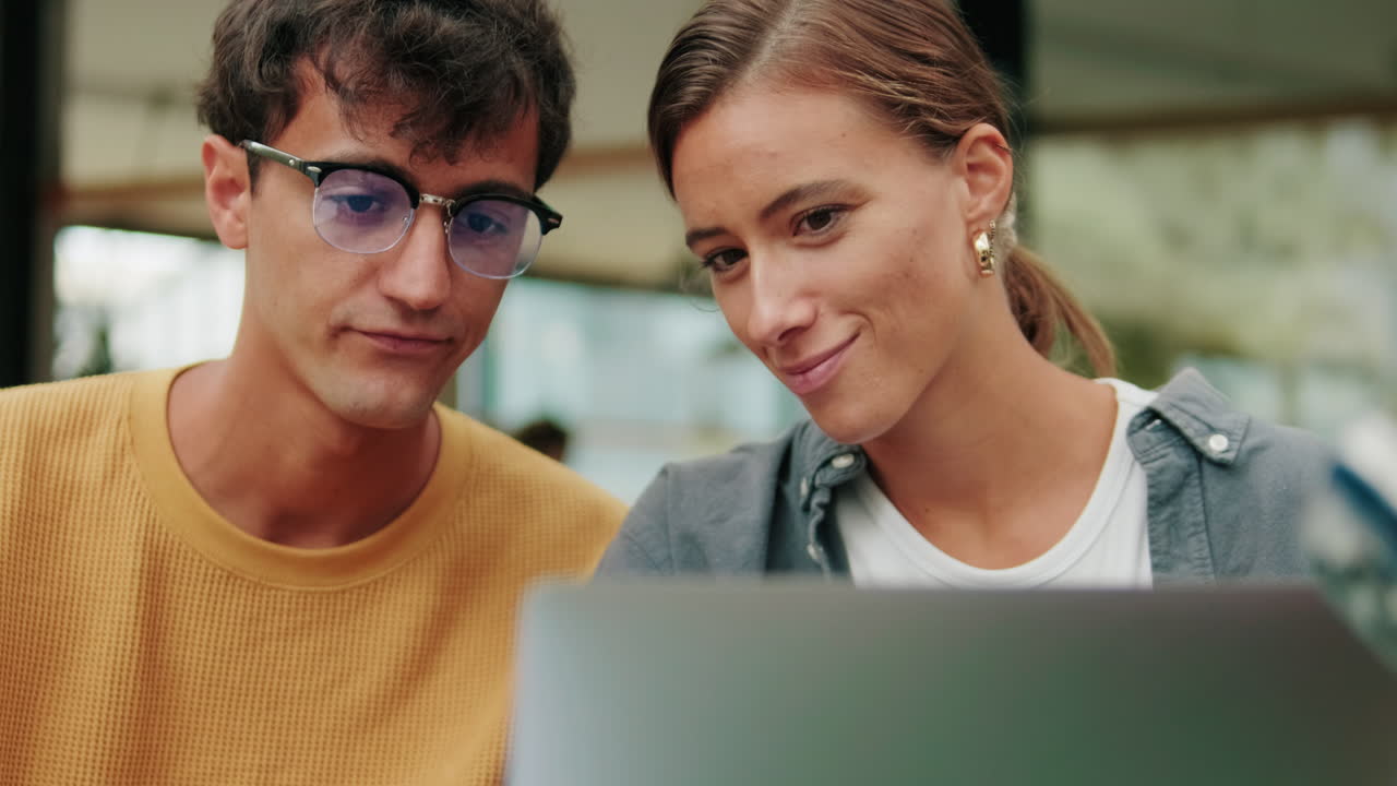 Close up of students of different nationalities use modern technology, laptop