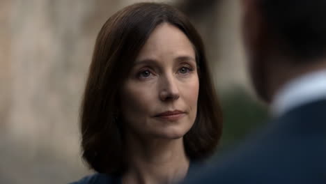 a serious woman looking intently at someone