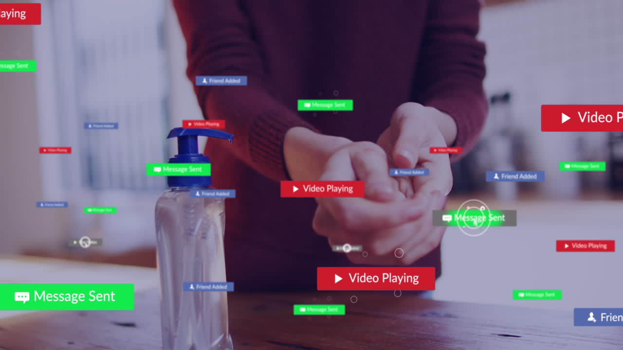 Animation of media icons over caucasian woman disinfecting hands
