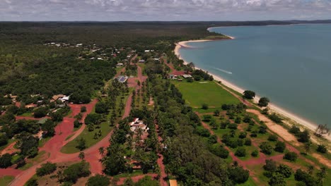 overhead moving aerial clip of remote community coastline in northern australia