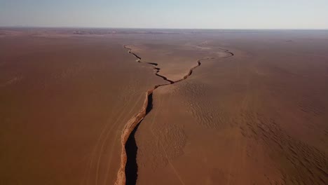 geological fault line in desert geology phenomenon scenic landscape of panoramic endless dry flat land summer season the wonderful peaceful travel destination adventure in iran lut snake twin valley