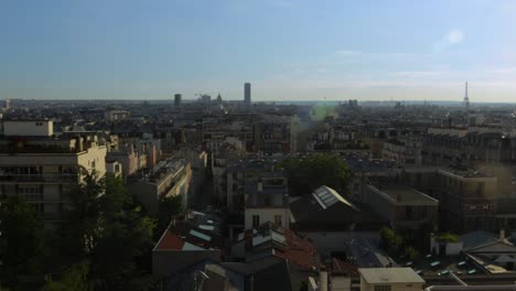 Timelapse-of-Paris-view-of-roofs-at-sunset-with-famous-monuments-in-the-distance,-few-pollution-and-warm-rich-colors