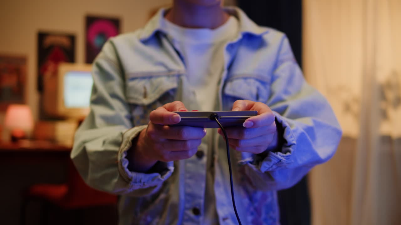 Person playing retro mobile game