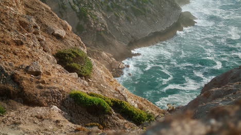 deep sea water rocky coastline vertical. stone mountain washed atlantic ocean