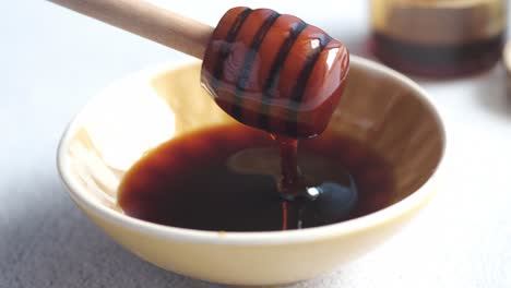 honey dipping in a bowl