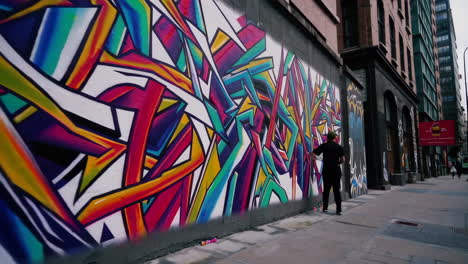 colorful graffiti mural on city wall with people