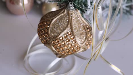 christmas jewelry of gold color. new year's toys on a christmas tree.