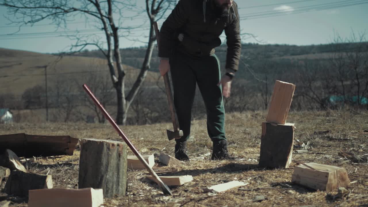 Cracking firewood with an axe