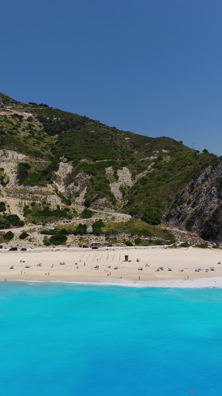 Myrtos beach on Kefalonia Island, Ionian Sea, Aerial pullack shot, Vertical