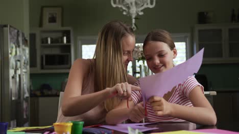 Mother-and-daughters-painting-together