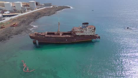 calm aerial view flight liquified natural gas lng factory ship accident
shipwreck on beach lanzarote canary islands, sunny day spain 2023