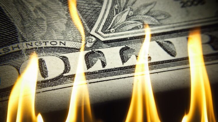 1 US dollar bill close-up on fire in flames on a black background . Conceptual 4k slow motion video. The idea of a financial crisis.