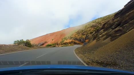 foggy drive through teide national park, canary islands, tenerife, spain: a driver’s perspective