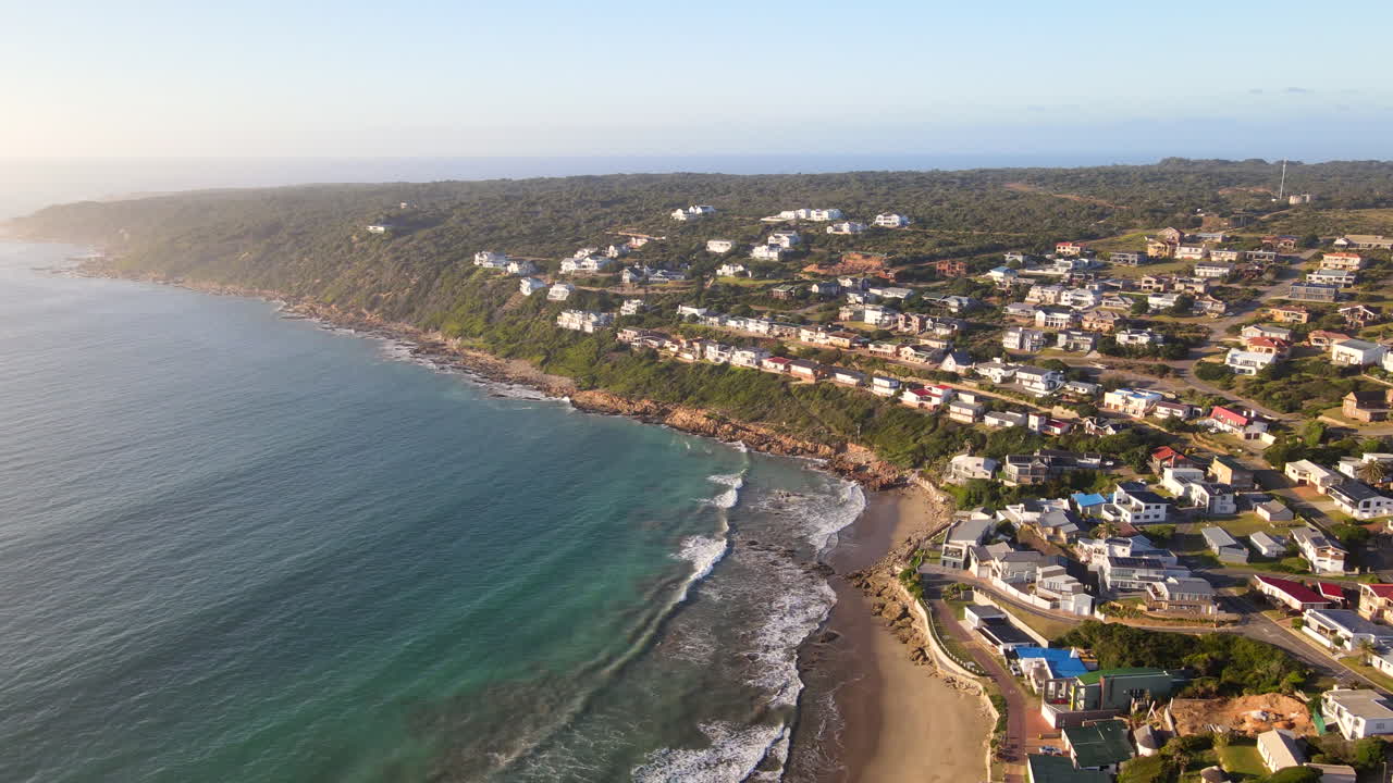 High sunrise drone view over exclusive coastal holiday town of Vleesbaai
