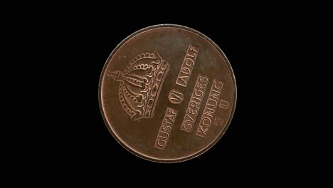 sweden 1968 5 öre coin obverse featuring the large incuse crown rotating on black background