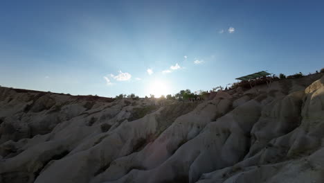 Aerial-through-the-historical-turist-site-of-Cappadocia-Turkey-aka-Turkiye-on-a-beautiful-summer-day