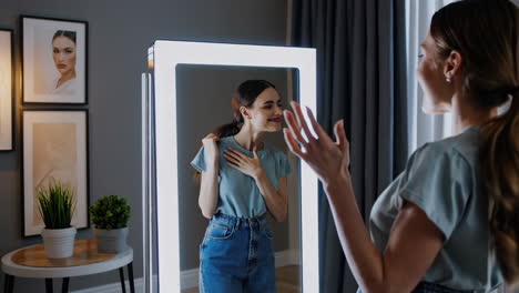 woman checking her outfit in smart mirror
