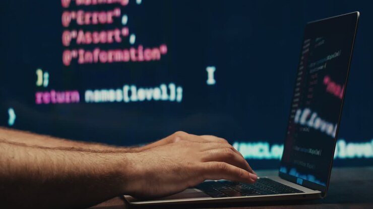 Man work with chatbot AI online, connecting with AI and using a chat bot. IT engineer software developer programmer interact with chat bot, making writing code. Typing on laptop keyboard close-up.