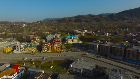 A-city-drone-shot-with-road-and-houses