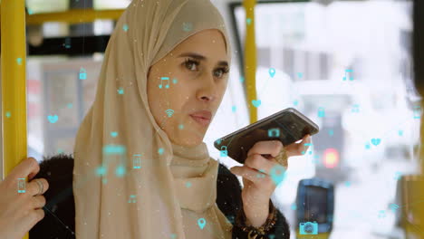 animation of connected icons, biracial woman wearing hijab using voice assistant in bus