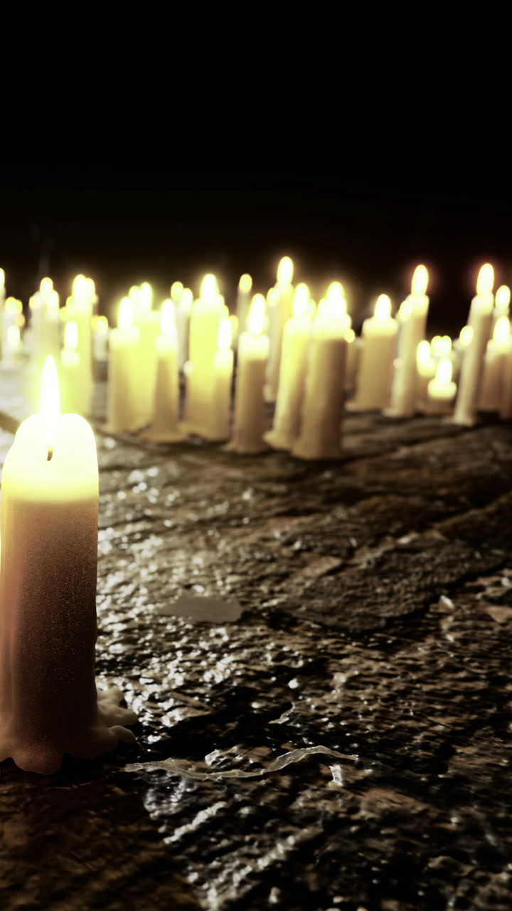 Candles illuminate a serene moment in a darkened setting at night