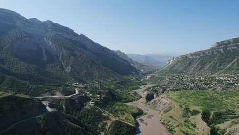 mountain valley with river and village