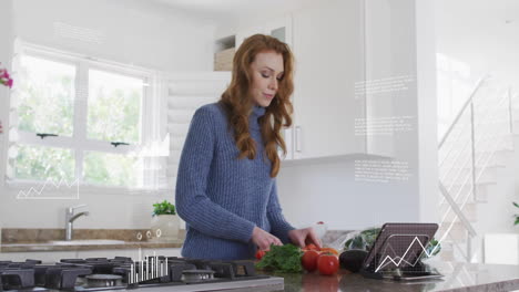 animation of digital data processing over caucasian woman using tablet and chopping vegetables