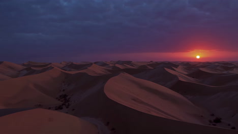 sunrise or sunset over a desert landscape