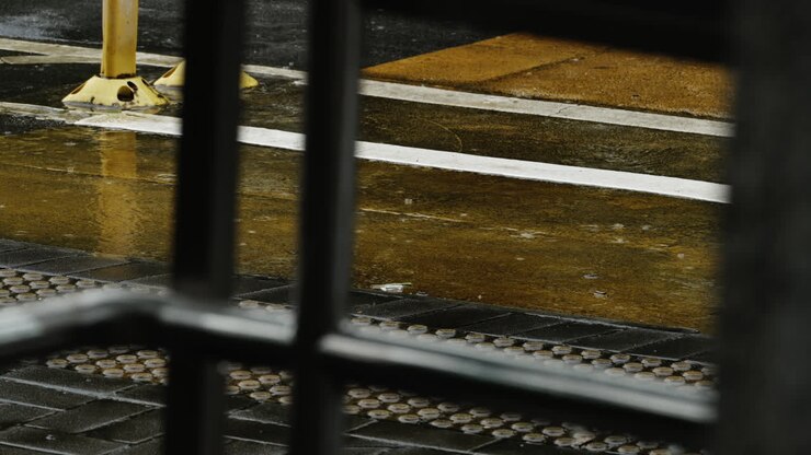 drizzling rain dripped on the paved road yellow