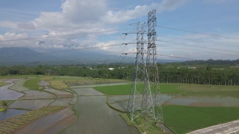 Aerial-view-of-high-voltage-electric-tower-with-blue-sky-on-the-background